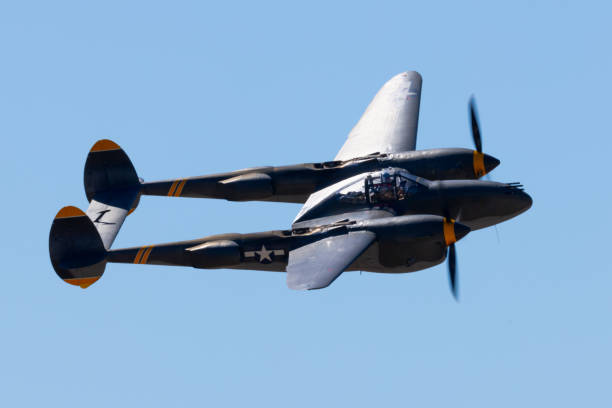 istock Very close side  view  of P38 Lightning (WWII American fighter plane) in beautiful sunset light 2190747309