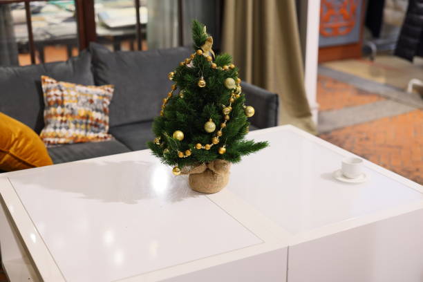 istock A beautifully festive miniature Christmas tree decor showcasing elegance on the table 2190748236