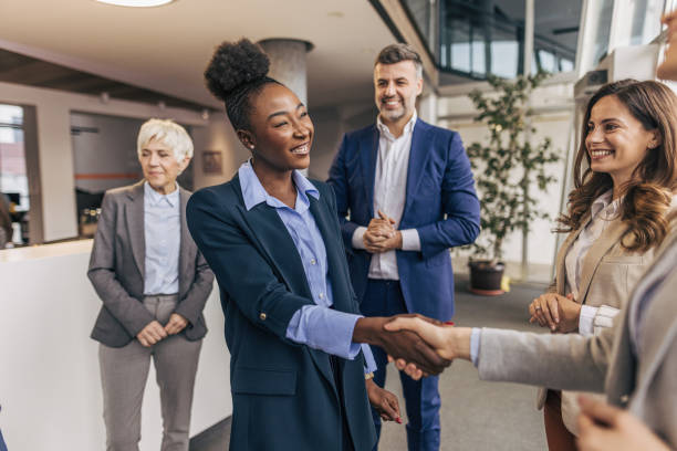 istock Business handshake between colleagues in formal attire 2190748487