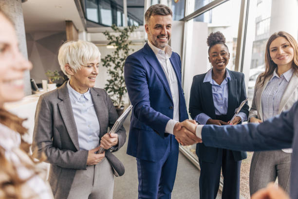 istock Business colleagues congratulate colleague in modern office 2190748721
