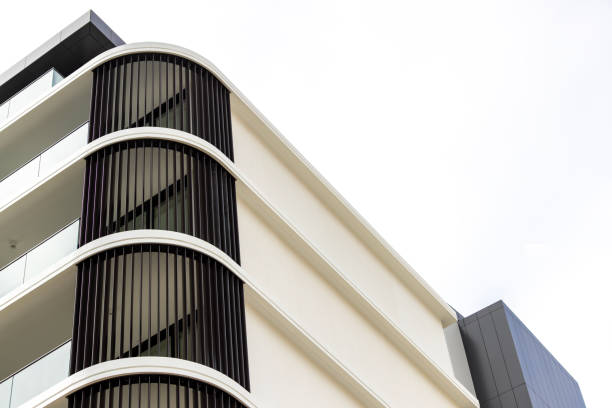 Closeup brand new modern apartment building, white background with copy space, full frame horizontal composition, Sydney Australia