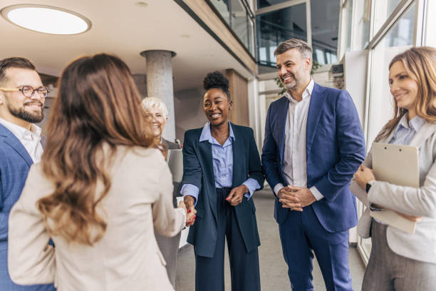 istock Business handshake between colleagues in formal attire 2190748981
