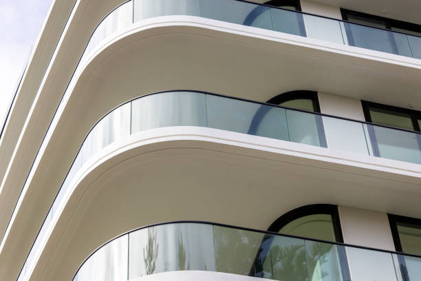 istock Closeup brand new modern apartment building, white background with copy space 2190749347