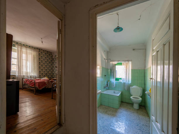 istock Exploring abandoned house: bedroom and bathroom unveiled in deserted home 2190753311