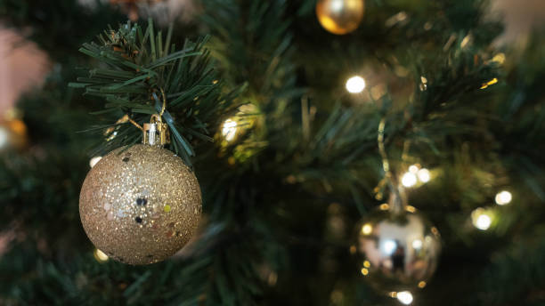 istock Christmas and New Year background. Christmas tree branch with hanging ball. 2190758029