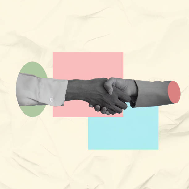 istock Professional handshake between a light skinned woman and a dark-skinned man in a corporate setting, fostering collaboration 2190758305
