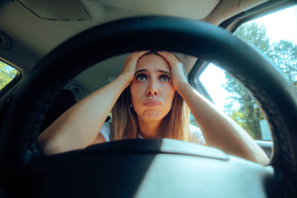 Overwhelmed Stressed Female Driver Behind the Wheel