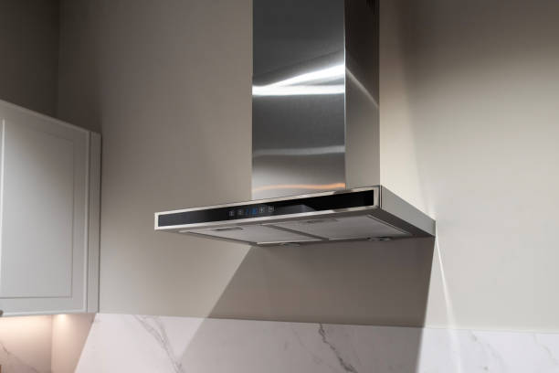 istock Modern metal kitchen hood on a white kitchen 2190759073
