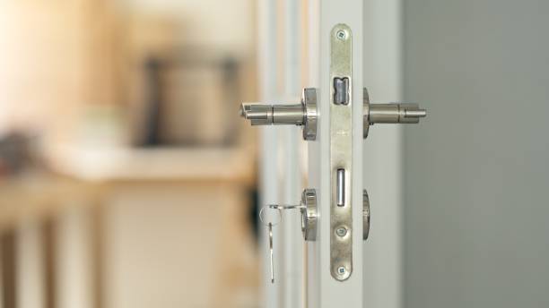 istock Opened White Door with Key. Coming Home. Going Out 2190759530