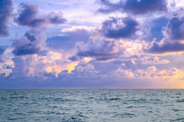 Stormy cloudy sky. Big cloud above ocean. Dark cloudy sky at sunset background. Cloud sky with sea background