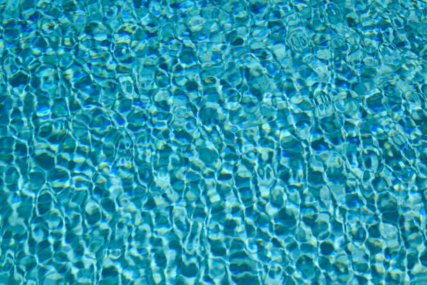 Swimming pool water with copy space. Water surface in swimming pool. Blue water background. Clear sea water texture. Sea ocean background