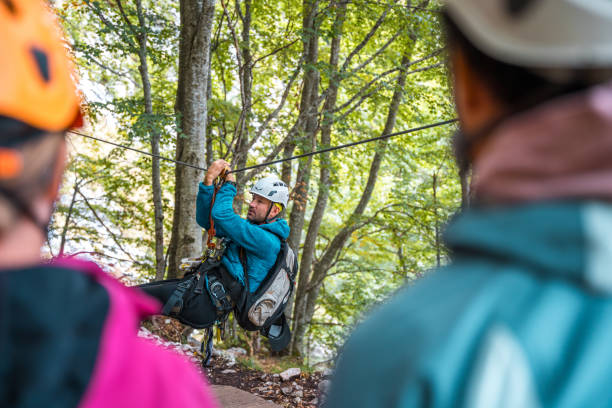istock Diverse Group with Male Instructor on Zip Line in Forest 2190760445