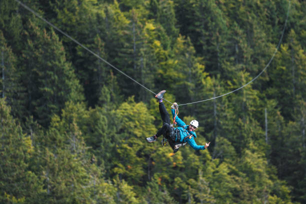 istock Energetic Male Adventurer on Zip Line in Forest Setting 2190760460
