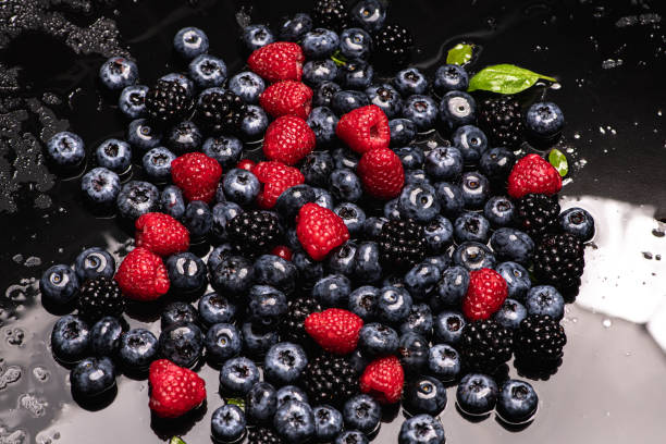 istock Berries closeup. Mix of blueberry, raspberry, red currant. Fresh berries as background. Texture of fresh berries. Berry mix. Berries berry background. 2190760919