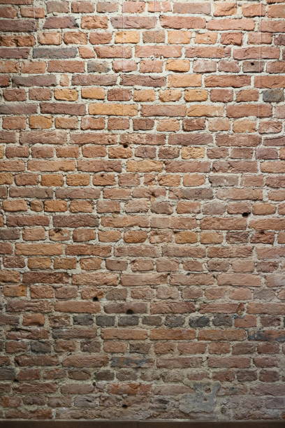 istock This is a captivating design featuring a rustic textured brick wall, ideal for enhancing spaces 2190762091