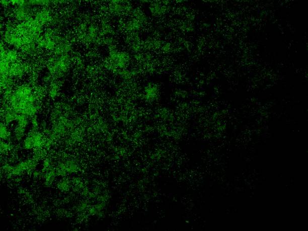 istock Illustration of green glowing abstract particles on a black background 2190762253