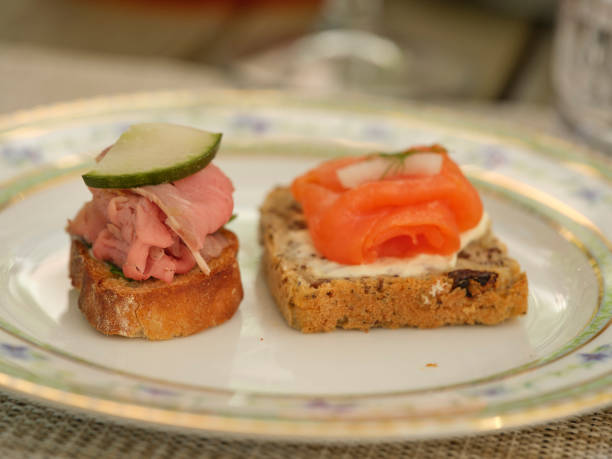 Beautifully crafted appetizers on rustic breads served in Mallorca, Spain, emphasizing natural local flavors and artistry.