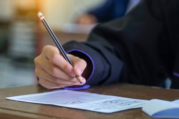 istock Asian students are taking exams to measure learning in the classroom. Soft and selective focus. 2190768303