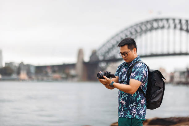 istock Tourist taking photos at Sydney Harbour, Australia 2190768592