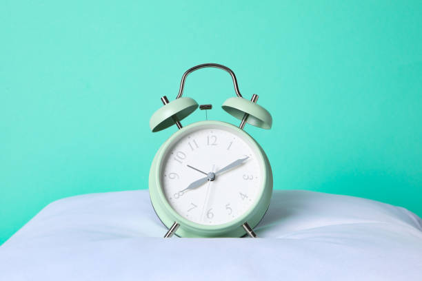 istock Concept of sleep and wake up with alarm clock 2190769590