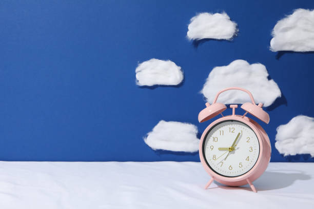 istock Concept of sleep and wake up with alarm clock 2190769986