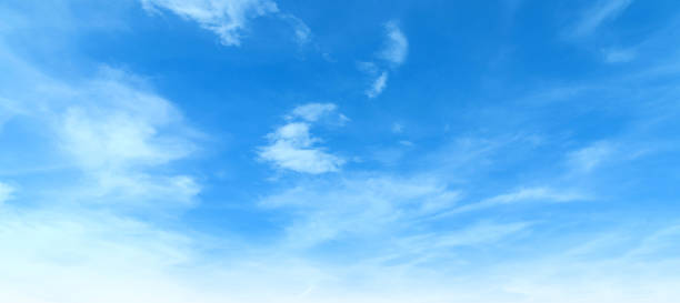 istock cyan skyline wide vivid gradient hues blending smooth cloudscape. fluffy clouds calm sunlight gloomy atmosphere. Wallpaper, the weather clear blue sky, cloudy layers, the climate. 2190771260