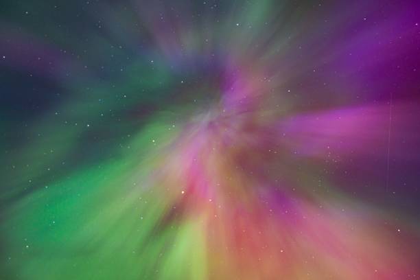 istock Vibrant aurora borealis with green and purple hues. 2190772929