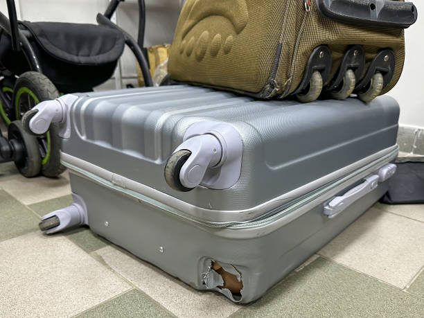 istock Broken suitcase close-up in a suitcase repair shop. 2190773976