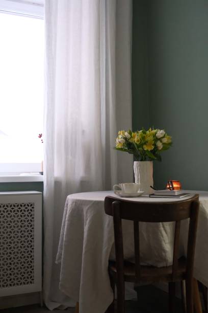 istock A Cozy Interior Featuring Beautiful Flowers and Soft Candles in Warm, Inviting Tones 2190774135