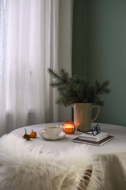 istock A beautifully warm indoor setting that includes delicious green tea, soft candles, and lovely seasonal greenery. Christmas mood. 2190774209