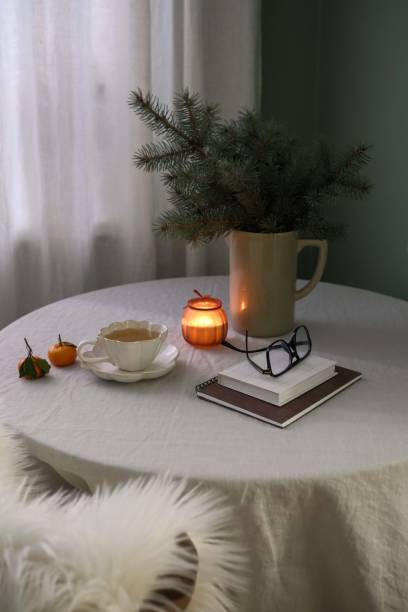 istock A beautifully warm indoor setting that includes delicious green tea, soft candles, and lovely seasonal greenery. Christmas mood. 2190774276