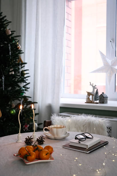 A winter table setting with bright oranges, creating a cozy atmosphere and delightful holiday decorations