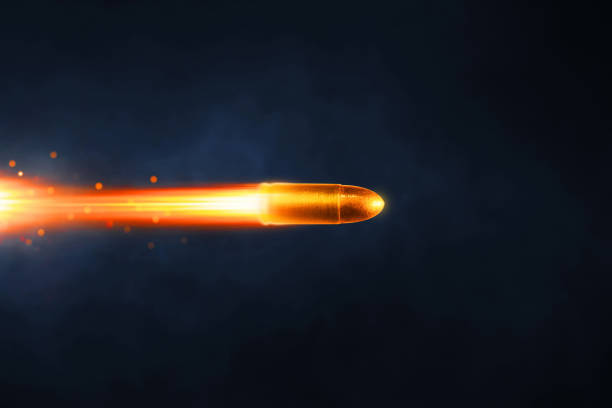 Golden bullet flying on dark background