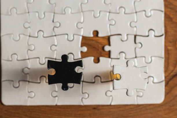 istock Choosing the right option. Conceptual image using a black and white puzzle 2190776125
