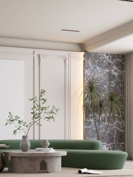 istock A modern, minimalist living space with a green sofa, decorative plants, and a stylish marble wall, creating a serene and inviting atmosphere. 3D rendering 2190777120