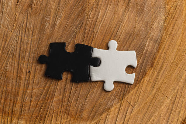 istock puzzle pieces, black and white, concept of unity between opposites 2190777323