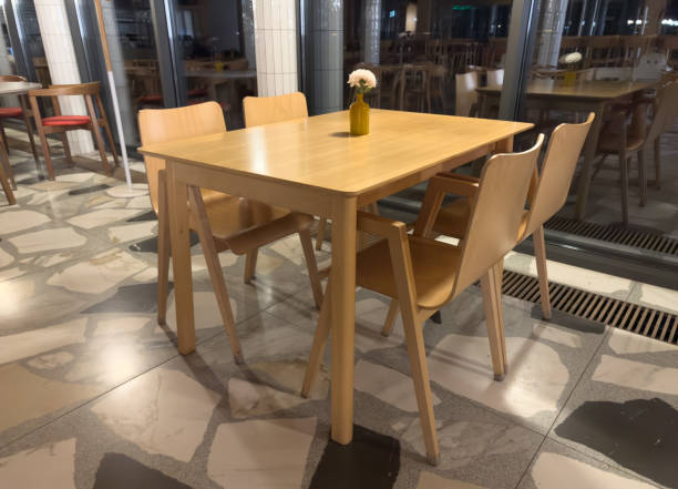 istock A wooden table with four chairs around it 2190778464