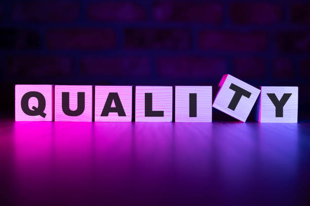 Quality word with wooden blocks on table