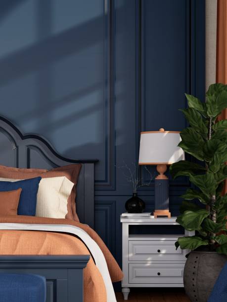 istock A modern bedroom blue wall, cozy bedding, a bedside lamp, and a decorative plant, creating a serene and inviting atmosphere. 3D rendering 2190780533