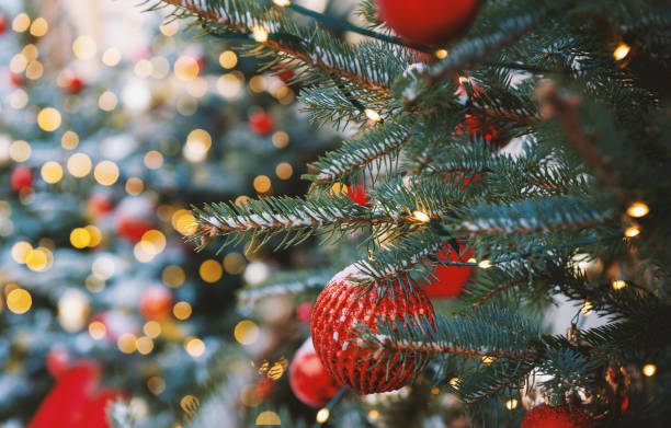 istock Festive pine tree decoration captured with a cozy, bokeh-filled background 2190780709