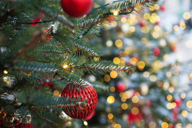 istock Festive pine tree decoration captured with a cozy, bokeh-filled background 2190780760