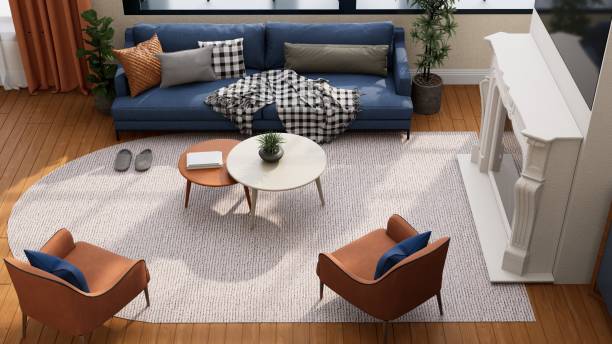 A cozy living room featuring a blue sofa, modern chairs, a round coffee table, and a stylish rug, creating a warm and inviting atmosphere. 3D rendering
