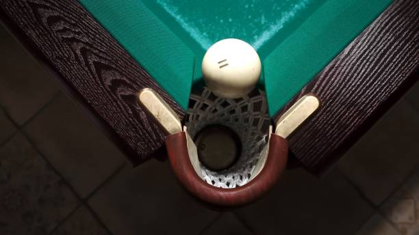 Mid adult man playing snooker in a bar