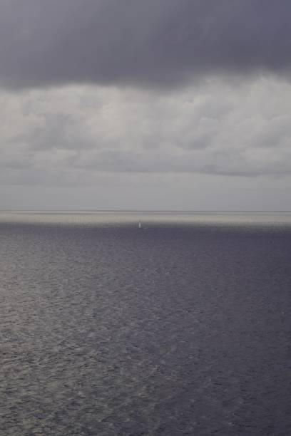 istock The sky with gray clouds over the ocean. Clouds over the Atlantic Ocean. Beautiful clouds over the sea. 2190782060