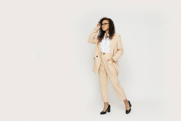 istock Attractive businesswoman in a suit on a light background 2190782467