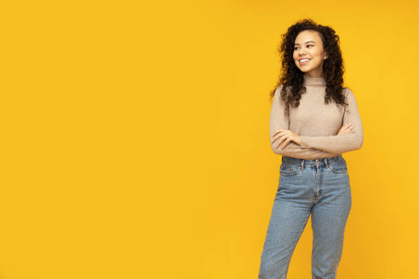 istock Young attractive girl on a yellow background 2190782870