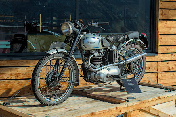 Hochgurgl, Austria - October 20, 2024: A testament to British engineering, this classic Triumph motorcycle sits on a platform. Its gleaming chrome and silver details highlight its vintage design.