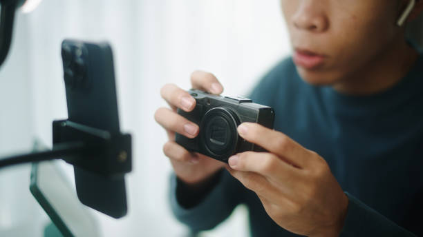 istock Young blogger or influencer review how to using a camera. 2190784471