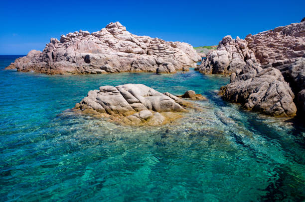 Cala Sarraina beach, not far from Paradise Coast, in Gallura, stands out majestically against the often rough waters of the Strait of Bonifacio. The colors of the sea are stunning. Even in the summer high season, these wonderful beaches are relatively deserted.