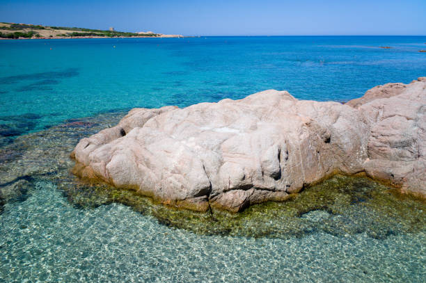 Marinedda beach, just under the city center of Isola Rossa, in Gallura, stands out majestically against the often rough waters of the Strait of Bonifacio. The colors of the sea are stunning. Even in the summer high season, these wonderful beaches are relatively deserted.